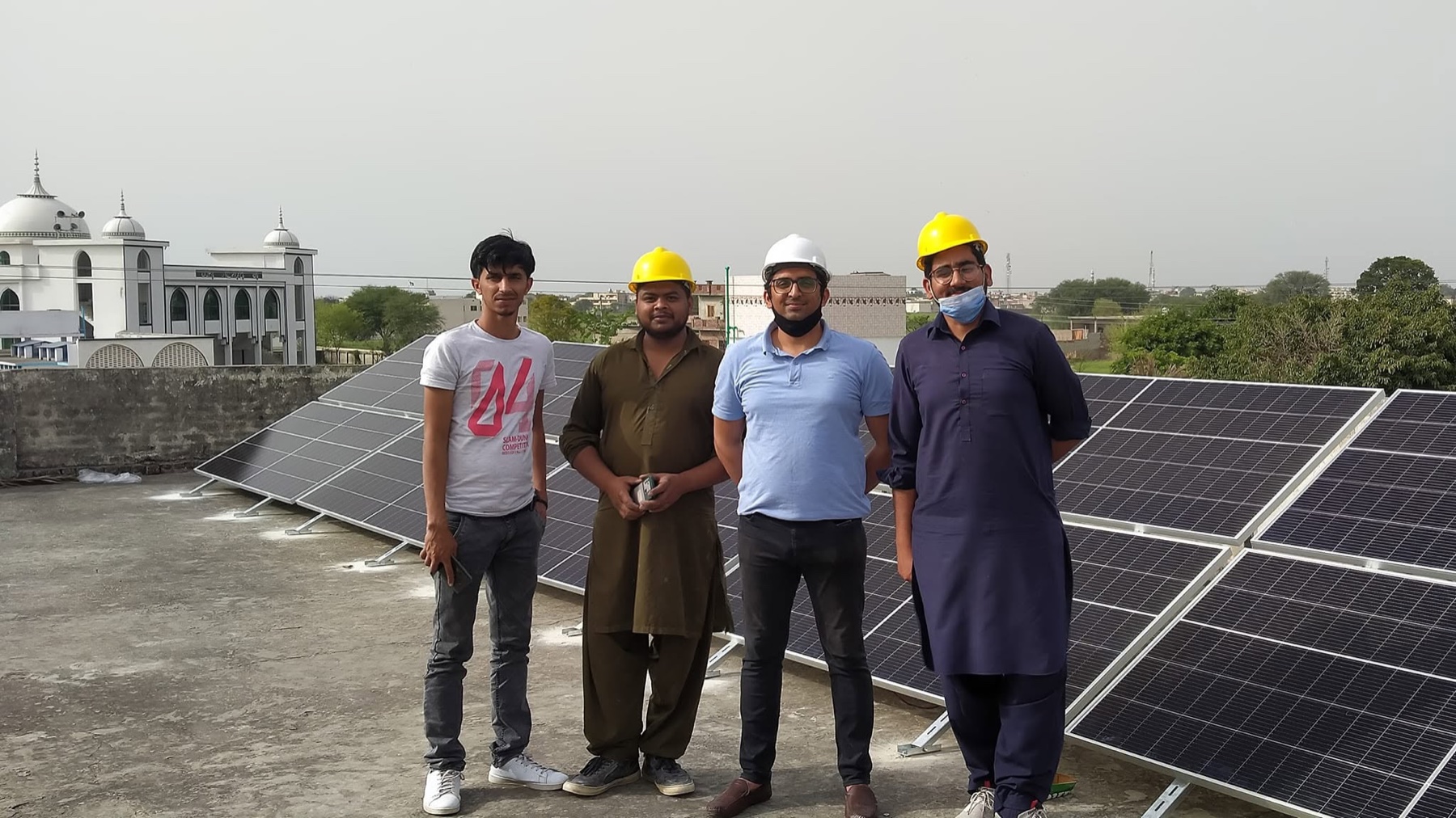 Pakistan Solar Solutions team on a completed rooftop installation.